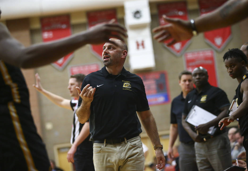Clark head coach Chad Beeten motions to his team during the first half of a Class 4A state boys basketball quarterfinal game against Desert Pines at Arbor View High School in Las Vegas on Wednesda ...