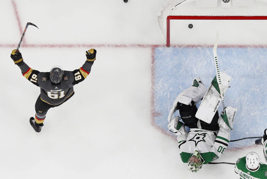 Vegas Golden Knights right wing Mark Stone (61) celebrates after left wing Max Pacioretty scored against Dallas Stars goaltender Ben Bishop (30) during the third period of an NHL hockey game Tuesd ...