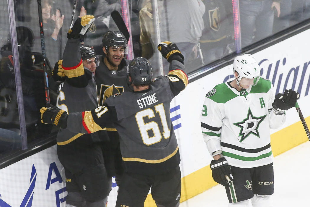 Golden Knights left wing Max Pacioretty, second from left, celebrates his goal with center Paul Stastny, left, and right wing Mark Stone (61) as Dallas Stars defenseman John Klingberg (3) reacts d ...