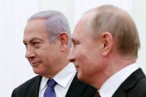 Russian President Vladimir Putin, right, and Israeli Prime Minister Benjamin Netanyahu pose for a photo during their meeting in the Kremlin in Moscow, Russia, Monday, May 27, 2013. (Maxim Shemetov ...