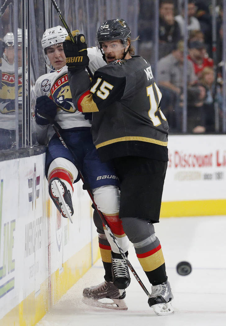 Vegas Golden Knights defenseman Jon Merrill (15) checks Florida Panthers center Frank Vatrano into the boards during the first period of an NHL hockey game Thursday, Feb. 28, 2019, in Las Vegas. ( ...