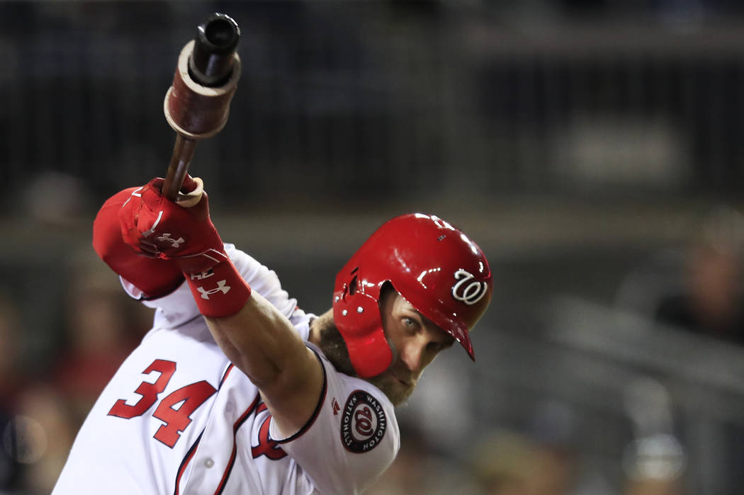 Washington Nationals Bryce Harper practices his swing during the seventh inning of a baseball game against the Miami Marlins in Washington, Wednesday, Sept. 26, 2018. (AP Photo/Manuel Balce Ceneta)