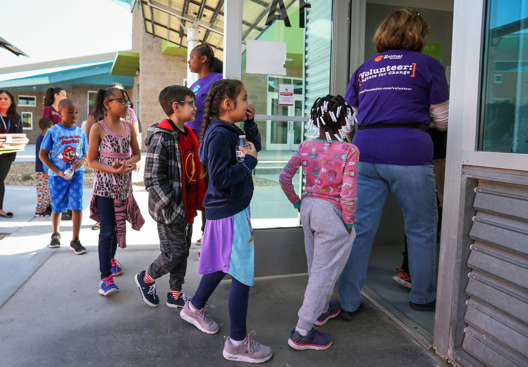 CCSD first graders line up to outside where the dogs are kept as participate in the 4th Annual ÔReading to Dogs in KennelsÕ event at The Animal Foundation during Nevada Reading Week in L ...