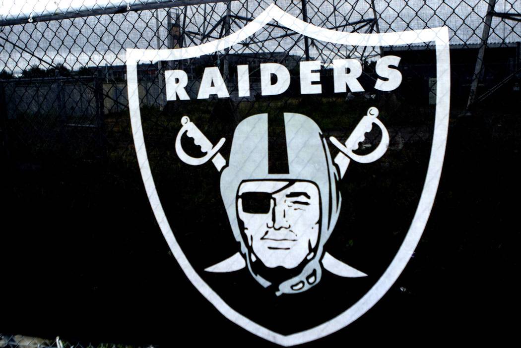 The Raiders logo hangs over a fence surrounding the Oakland Coliseum in Oakland, Calif., on Sunday, April 16, 2017. Heidi Fang/Las Vegas Review-Journal @HeidiFang