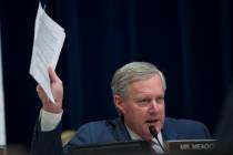 Rep. Mark Meadows, R-N.C., holds up documents as he questions Michael Cohen, President Donald Trump's former lawyer, as Cohen testifies before the House Oversight and Reform Committee, on Capitol ...