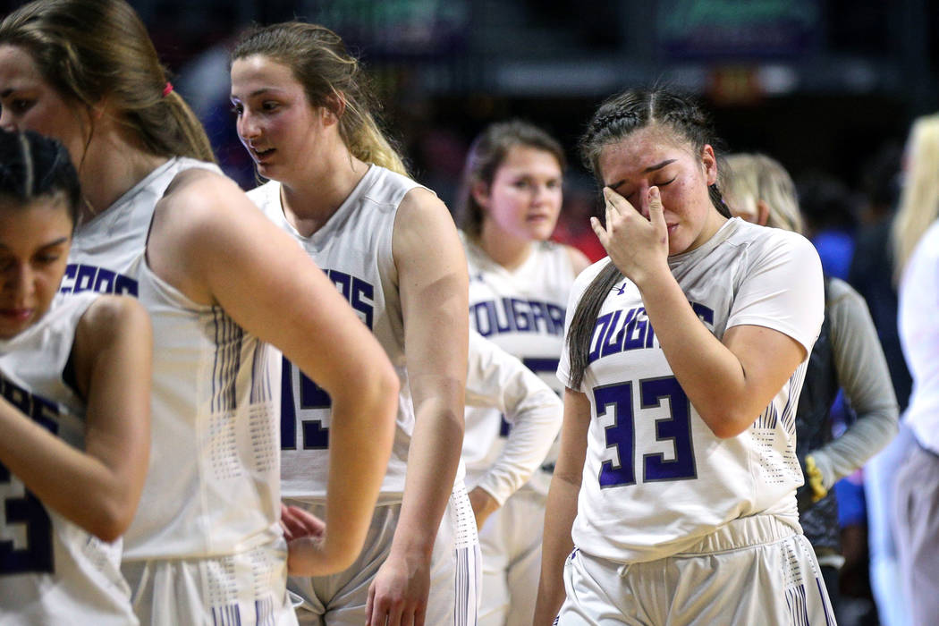 Spanish Springs' Mariah Barraza (33) wipes away tears after losing to Bishop Gorman during a Class 4A state girls basketball semifinal game at the Orleans Arena in Las Vegas, Thursday, Feb. 28, 20 ...
