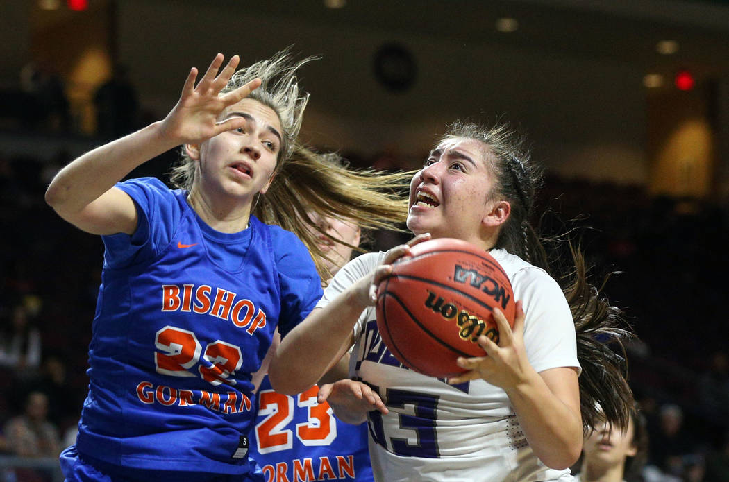 Spanish Springs' Mariah Barraza (33) drives to the net while being guarded by Bishop Gorman's Alexis Kruljac (22) during the second half of a Class 4A state girls basketball semifinal game at the ...