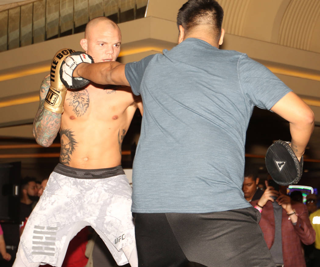 UFC light heavyweight Anthony Smith hits mitts with his coach Danny Molina, right, at UFC 235 open workouts at the MGM Grand hotel-casino in Las Vegas, Thursday, Feb. 28, 2019. (Heidi Fang /Las Ve ...