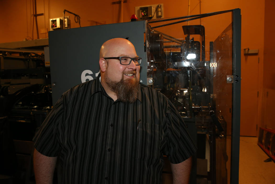 Red Rock Lanes Bowling Operations Manager Dennis Mathews talks to a reporter in the pin setting ...