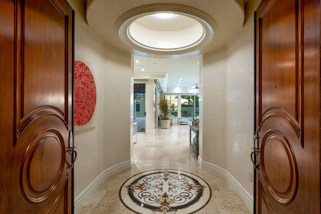 The grand entrance to this One Queensridge Place garden-level high-rise home. (Ivan Sher Group)