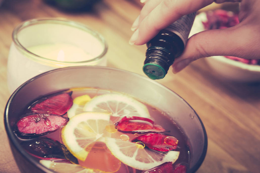 Create your own aromatherapy treatment by pouring essential oil into a bowl of fresh fruit. (Getty)