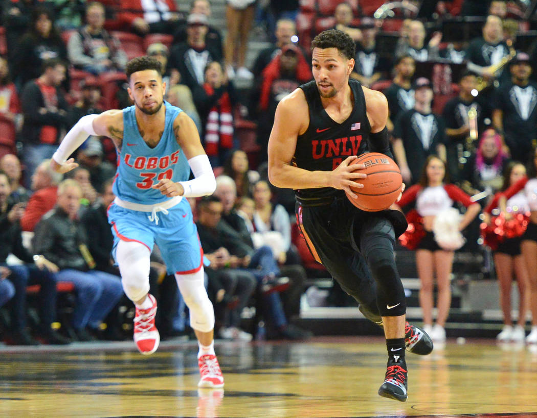 UNLV Rebels guard Noah Robotham (5) dribbles the ball on a breakaway during the first half of the UNLV Rebels and the New Mexico Lobos NCAA basketball game at the Thomas & Mack Center in Las V ...