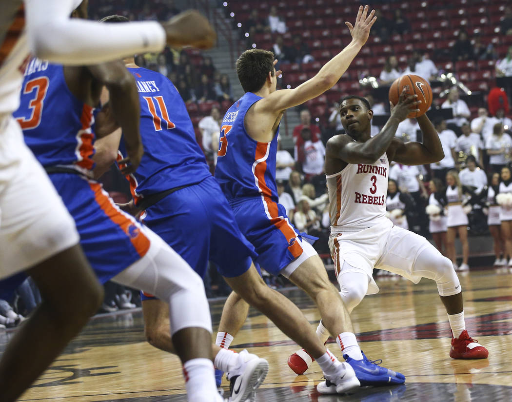 UNLV Rebels guard Amauri Hardy (3) moves the ball around Boise State Broncos guard Justinian Jessup (3) during the first half of a basketball game at the Thomas & Mack Center in Las Vegas on S ...