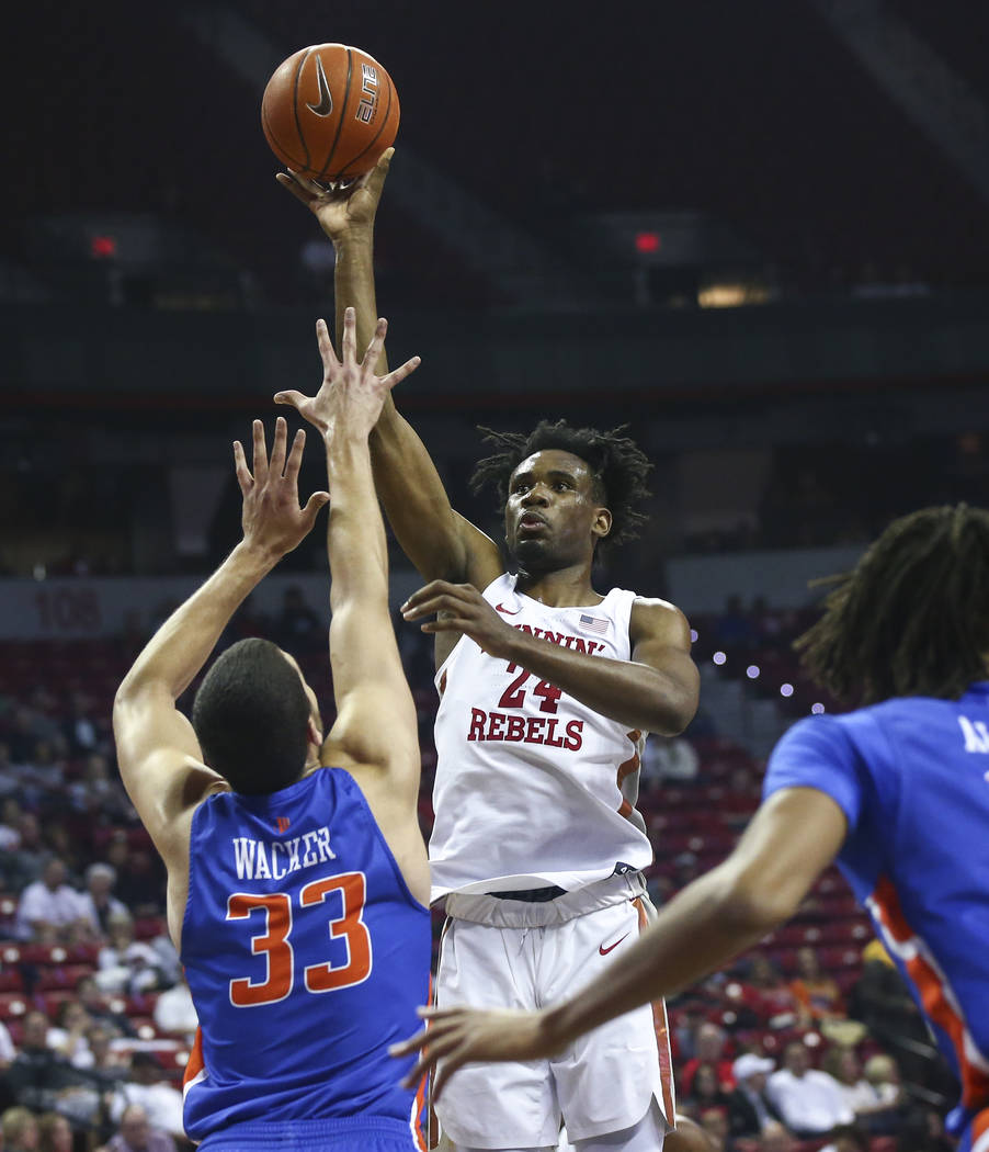 UNLV Rebels forward Joel Ntambwe (24) shoots over Boise State Broncos forward David Wacker (33) during the first half of a basketball game at the Thomas & Mack Center in Las Vegas on Saturday, ...