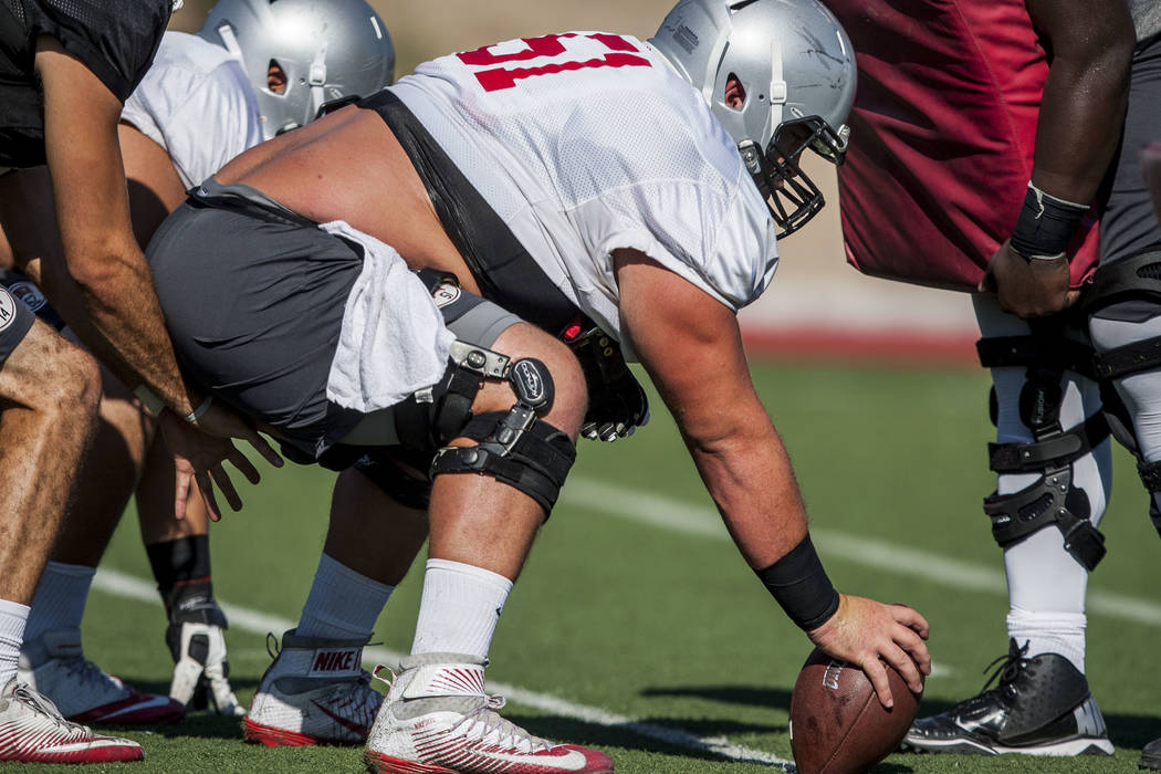 UNLV center Zack Singer prepares to snap the ball during training camp at Rebel Park on Tuesday, Aug. 8, 2017. Patrick Connolly Las Vegas Review-Journal @PConnPie