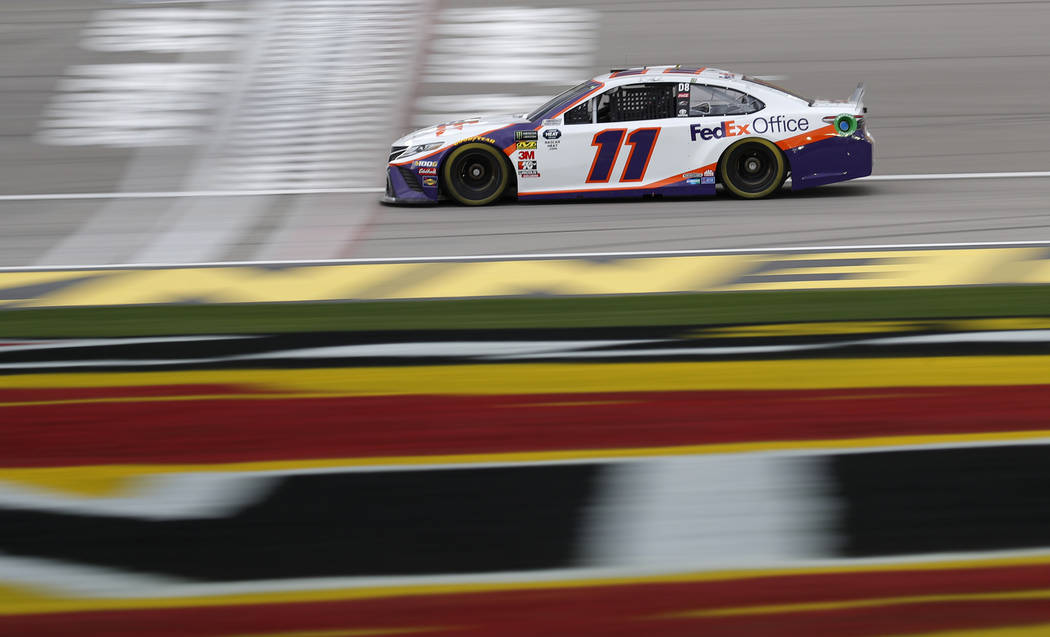 Denny Hamlin (11) drives during qualifying for the NASCAR Cup Series auto race at Las Vegas Motor Speedway, Friday, March 1, 2019, in Las Vegas. (AP Photo/John Locher)