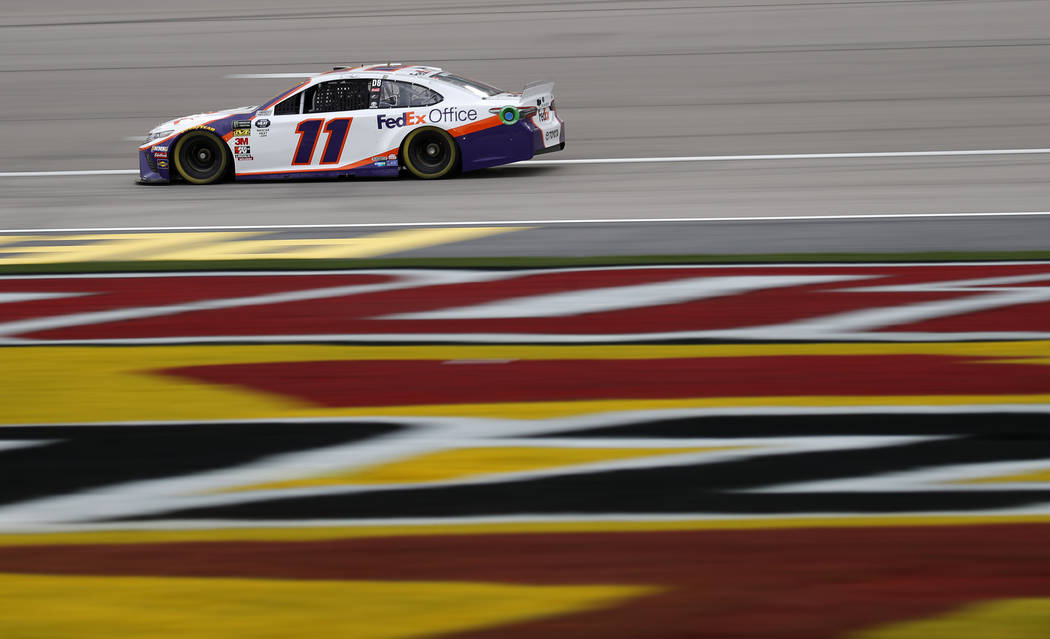 Denny Hamlin drives during qualifying for the NASCAR Cup Series auto race at Las Vegas Motor Speedway, Friday, March 1, 2019, in Las Vegas. (AP Photo/John Locher)