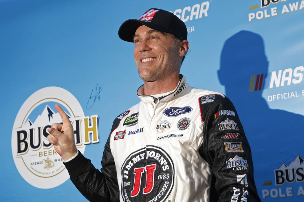 Kevin Harvick poses for photographers after winning the pole position during qualifying for a NASCAR Cup Series auto race at the Las Vegas Motor Speedway, Friday, March 1, 2019, in Las Vegas. (AP ...