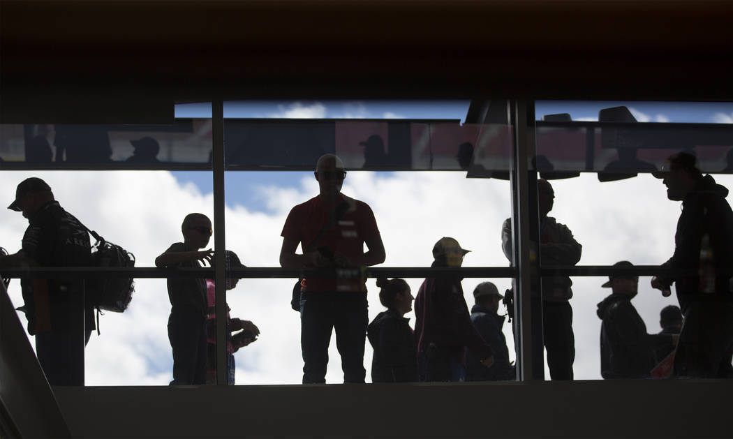 Fans watch Brad Keselowski's car get worked on from the skywalk on Saturday, March 2, 2019, at Las Vegas Motor Speedway, in Las Vegas. (Benjamin Hager Review-Journal) @BenjaminHphoto