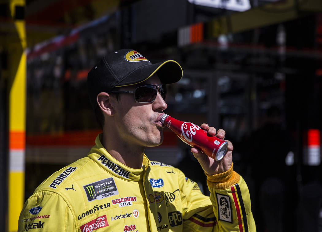 Joey Logano (22) takes a sip of Coke before the start of practice on Saturday, March 2, 2019, at Las Vegas Motor Speedway, in Las Vegas. (Benjamin Hager Review-Journal) @BenjaminHphoto