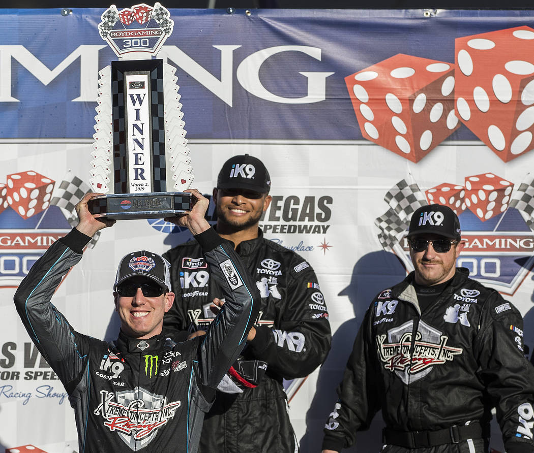 Kyle Busch, left, hoists the trophy for winning the NASCAR Xfinity Series Boyd Gaming 300 on Saturday, March 2, 2019, at Las Vegas Motor Speedway, in Las Vegas. (Benjamin Hager Review-Journal) @Be ...