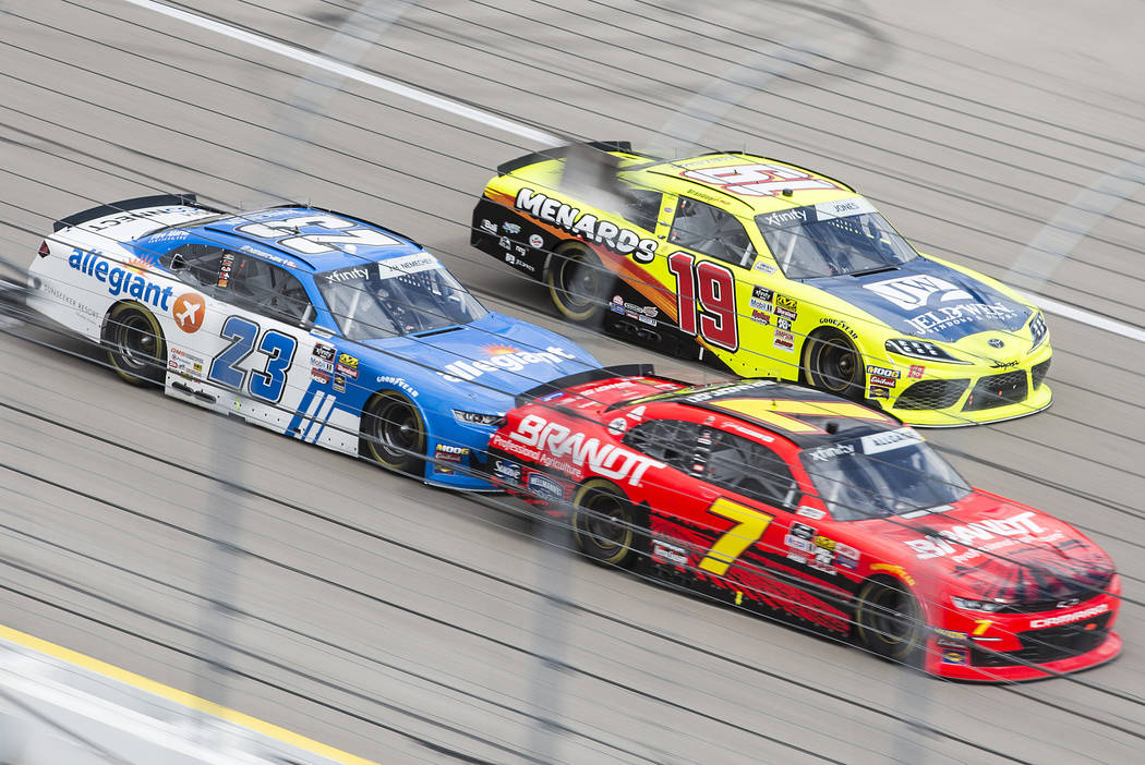 John Hunter Nemechek (23), Brandon Jones (19) and Austin Allgaier (7) race around turn one during the NASCAR Xfinity Series Boyd Gaming 300 on Saturday, March 2, 2019, at Las Vegas Motor Speedway ...