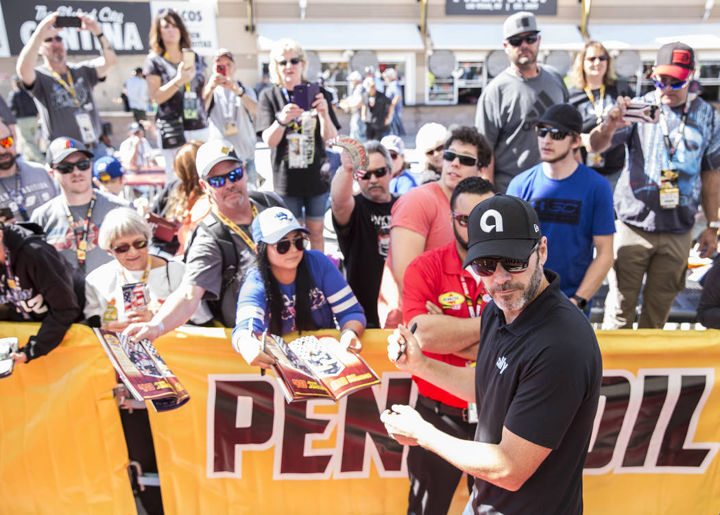 Jimmie Johnson signs autographs before the start of the Monster Energy NASCAR Cup Series Pennzoil 400 on Sunday, March 3, 2019, at Las Vegas Motor Speedway, in Las Vegas. (Benjamin Hager Review-Jo ...