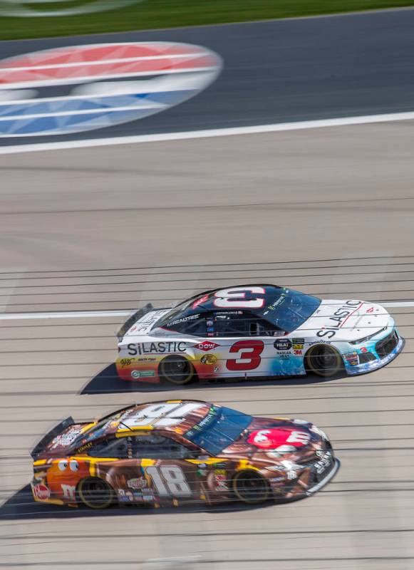 Kyle Busch (18) and Austin Dillon (3) compete for position around turn one during the Monster Energy NASCAR Cup Series Pennzoil 400 on Sunday, March 3, 2019, at Las Vegas Motor Speedway, in Las Ve ...