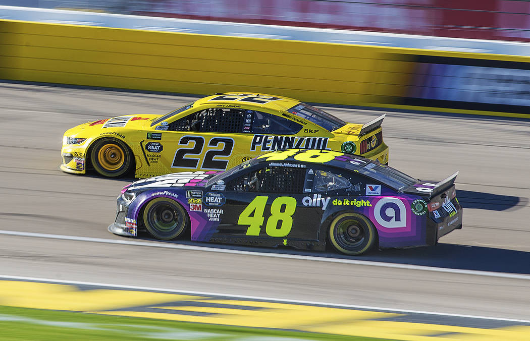 Joey Logano (22) passes Jimmie Johnson (48) in the final laps of the Monster Energy NASCAR Cup Series Pennzoil 400 on Sunday, March 3, 2019, at Las Vegas Motor Speedway, in Las Vegas. (Benjamin Ha ...