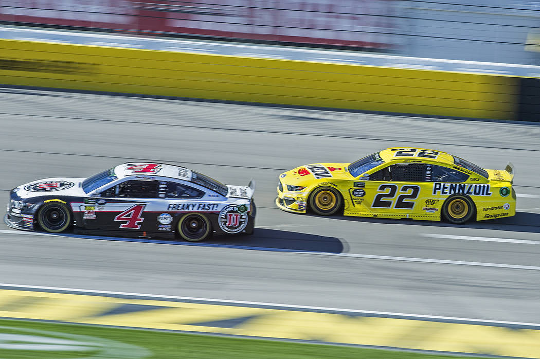 Joey Logano (22) and Kevin Harvick (4) fight for position in the final laps of the Monster Energy NASCAR Cup Series Pennzoil 400 on Sunday, March 3, 2019, at Las Vegas Motor Speedway, in Las Vegas ...