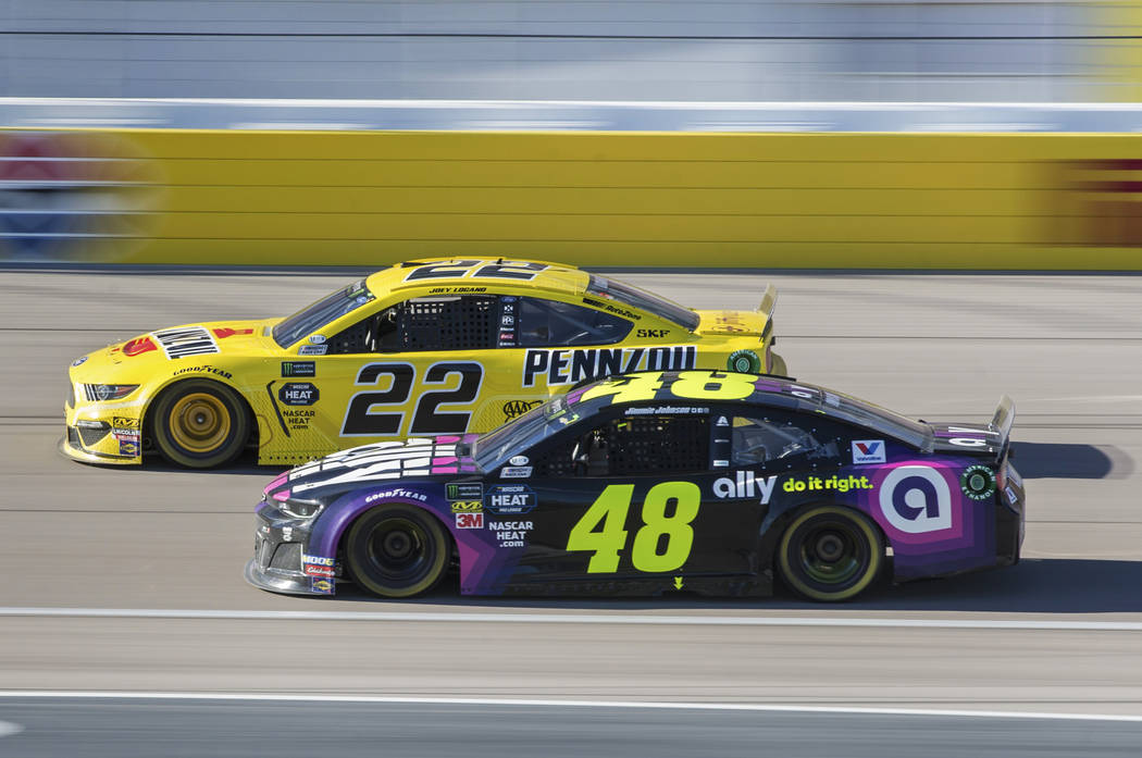 Joey Logano (22) passes Jimmie Johnson (48) in the final laps of the Monster Energy NASCAR Cup Series Pennzoil 400 on Sunday, March 3, 2019, at Las Vegas Motor Speedway, in Las Vegas. (Benjamin Ha ...