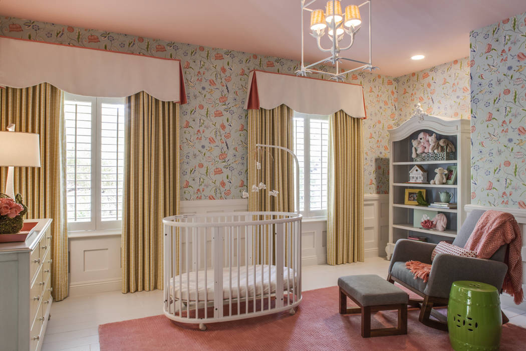 The white and orange fabric cornices and yellow drapes tie the look of this baby's room together. (P. Scinta Designs)