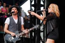 Metric's Emily Haines, left, and James Shaw perform at the Austin City Limits Music Festival, Saturday, Oct. 13, 2012, in Austin, Texas.(Photo by Jack Plunkett/Invision/AP)