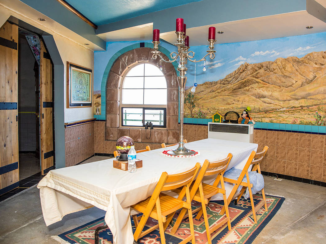 The dining room has views of the high-desert mountains and a mural on the wall. (Tonya Harvey Real Estate Millions)