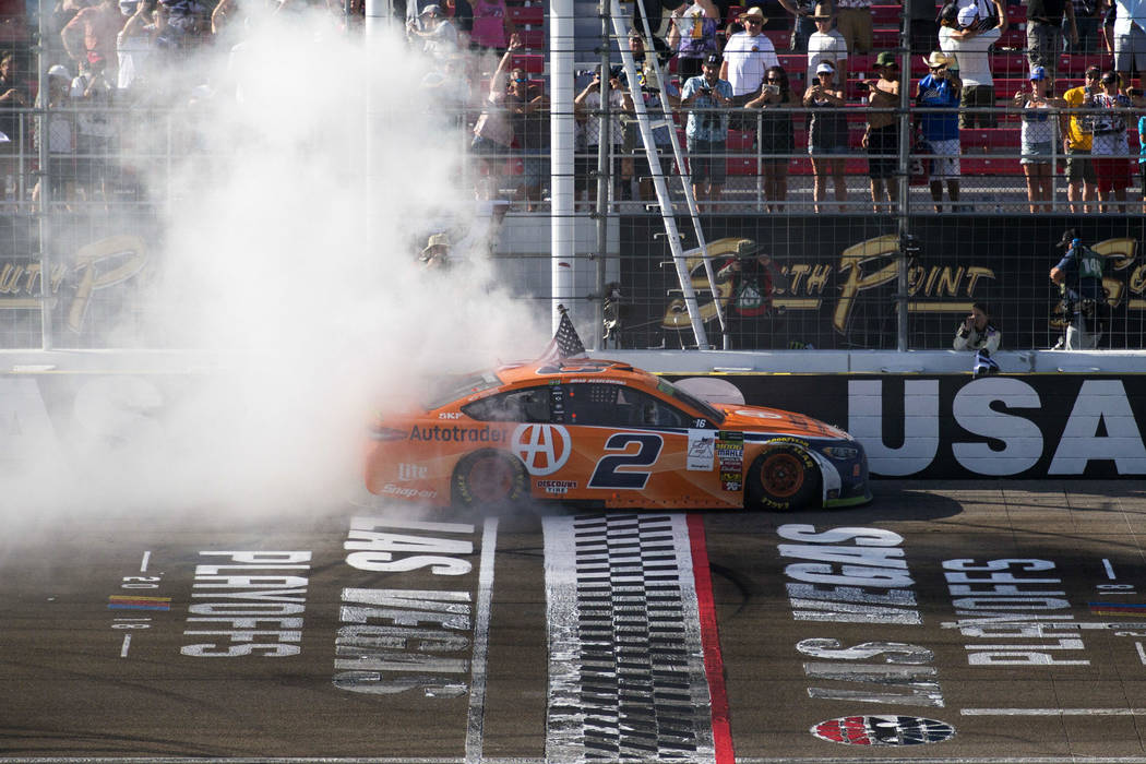 Race car driver Brad Keselowski celebrates with a burnout at the start/finish line after winning the South Point 400 NASCAR Cup Series auto race at the Las Vegas Motor Speedway in Las Vegas on Sun ...
