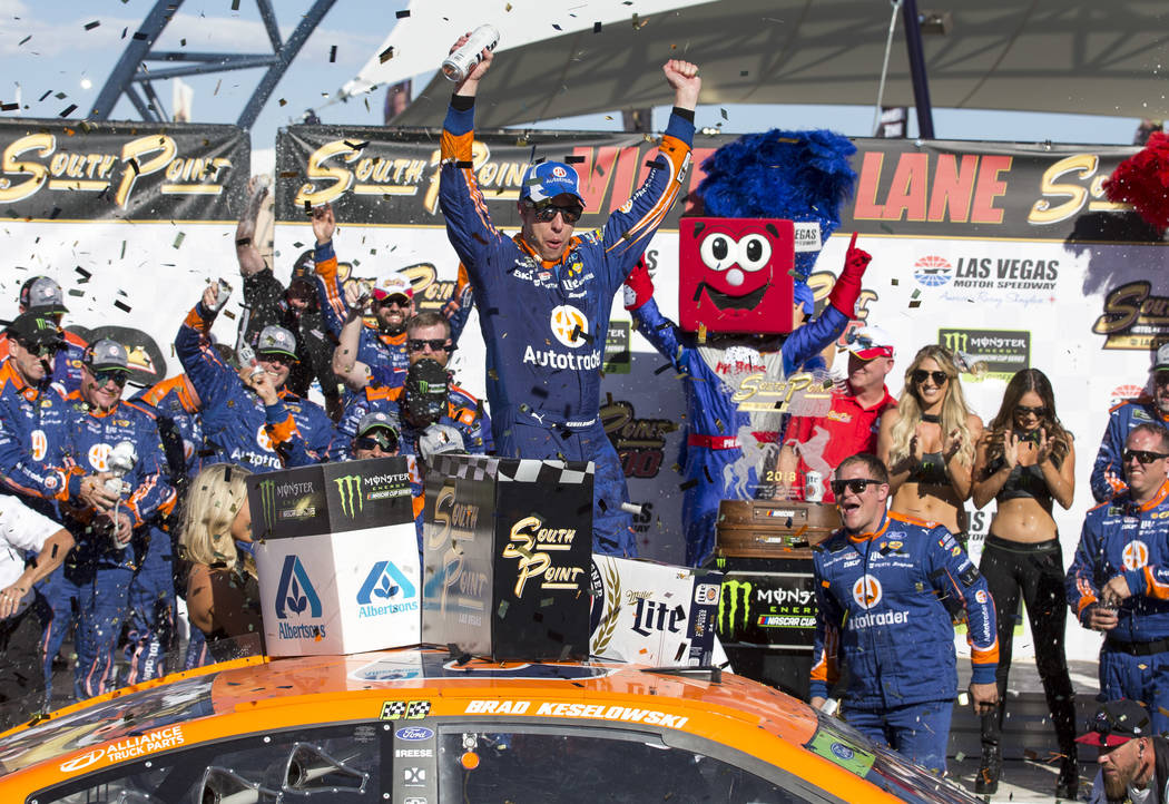 Race car driver Brad Keselowski celebrates in victory lane after winning the South Point 400 NASCAR Cup Series auto race at the Las Vegas Motor Speedway in Las Vegas on Sunday, Sept. 16, 2018. Ric ...