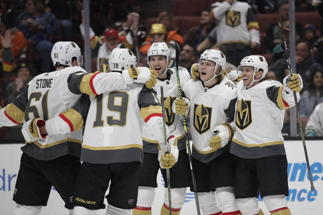 Vegas Golden Knights' Mark Stone, Reilly Smith, Shea Theodore, William Karlsson and Jonathan Marchessault, from left, celebrate a goal by Karlsson during the first period of the team's NHL hockey ...