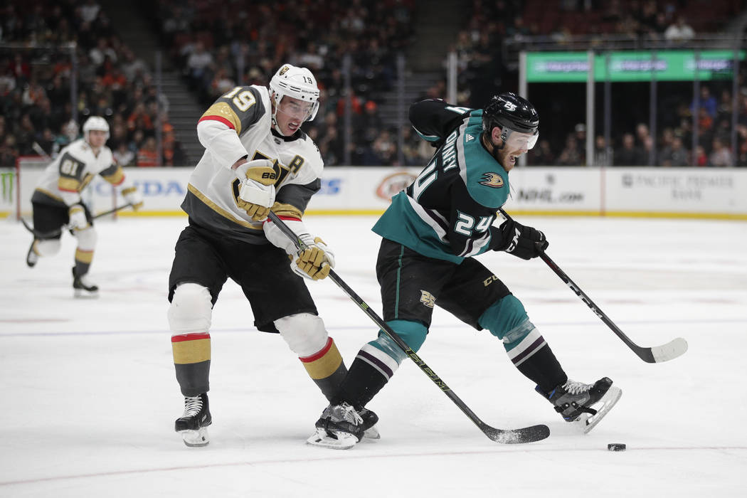 Anaheim Ducks' Carter Rowney, right, is pressured by Vegas Golden Knights' Reilly Smith during the second period of an NHL hockey game Friday, March 1, 2019, in Anaheim, Calif. (AP Photo/Jae C. Hong)