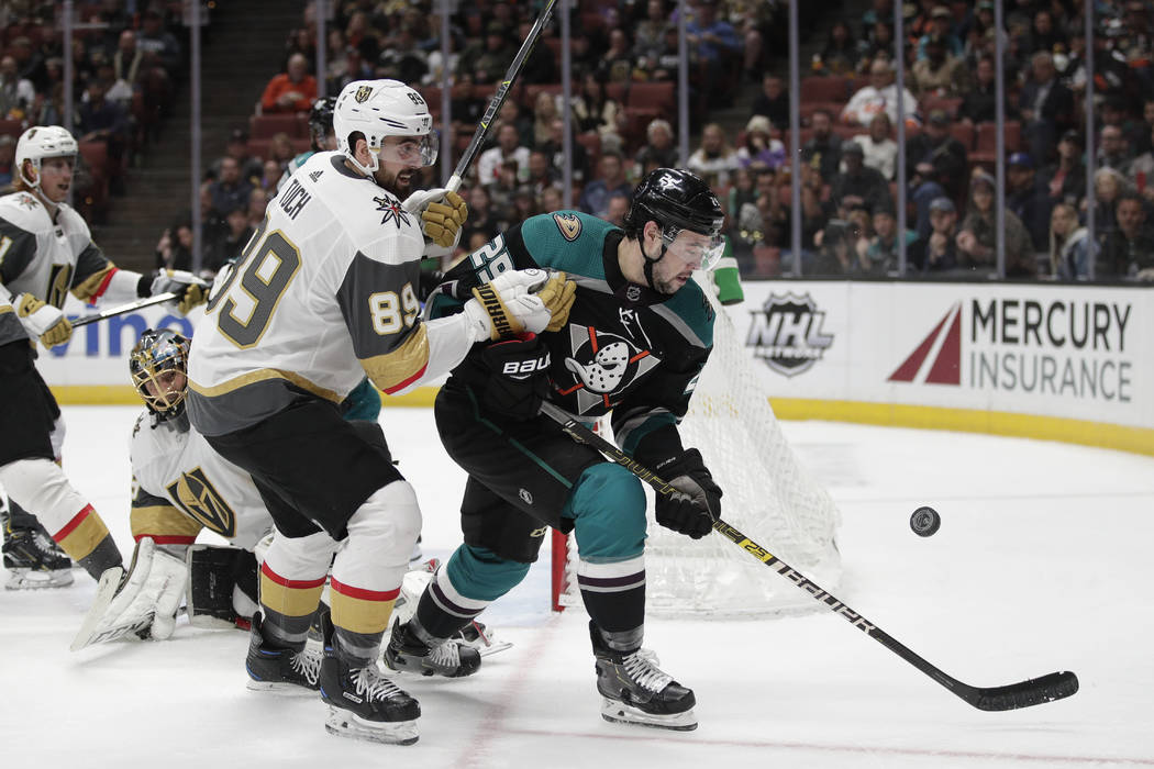 Anaheim Ducks' Devin Shore, right, and Vegas Golden Knights' Alex Tuch chase the puck during the second period of an NHL hockey game Friday, March 1, 2019, in Anaheim, Calif. (AP Photo/Jae C. Hong)