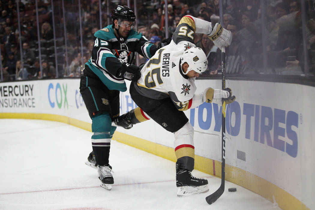 Vegas Golden Knights' Ryan Reaves, right, is defended by Anaheim Ducks' Jaycob Megna during the first period of an NHL hockey game Friday, March 1, 2019, in Anaheim, Calif. (AP Photo/Jae C. Hong)