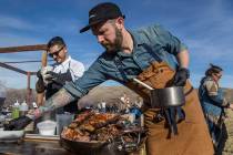 Momofuku's chef Shaun King, right, prepares lafah with slow-roasted short ribs during Whiskey in the Wilderness 2 on Jan. 14, 2018, at Spring Mountain Ranch State Park in Las Vegas. (Benjamin Hage ...