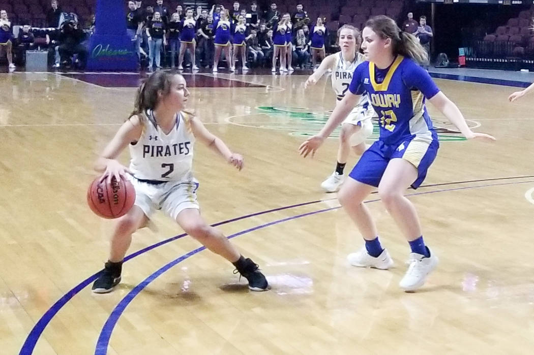Moapa Valley's Andalin Hillstead handles the ball as Lowry's Sydney Connors defends in the Class 3A state semifinals at Orleans Arena on Friday, March 1, 2019. The Pirates won 43-38. (Damon Seiter ...