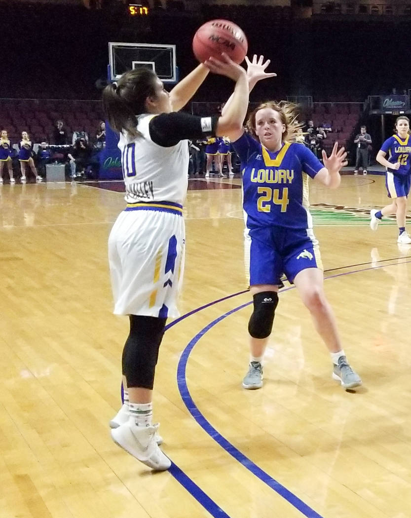 Moapa Valley's Peyton Schraft takes a jumper as Lowry's Sierra Maestrejuan defends in the Class 3A state semifinals at Orleans Arena on Friday, March 1, 2019. The Pirates won 43-38. (Damon Seiters ...
