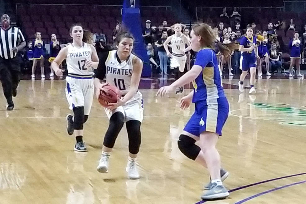 Moapa Valley's Peyton Schraft brings the ball down the floor against Lowry's Sierra Masestrejuan in the Class 3A state semifinals at Orleans Arena on Friday, March 1, 2019. The Pirates won 43-38. ...