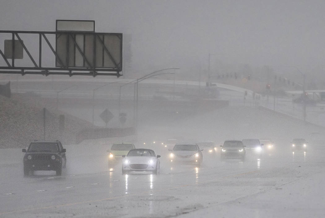 Drivers make their way through heavy rain on the 215 Beltway southbound on Thursday, Feb. 14, 2019, in Las Vegas. (Benjamin Hager Review-Journal) @BenjaminHphoto