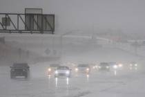 Drivers make their way through heavy rain on the 215 Beltway southbound on Thursday, Feb. 14, 2019, in Las Vegas. (Benjamin Hager Review-Journal) @BenjaminHphoto