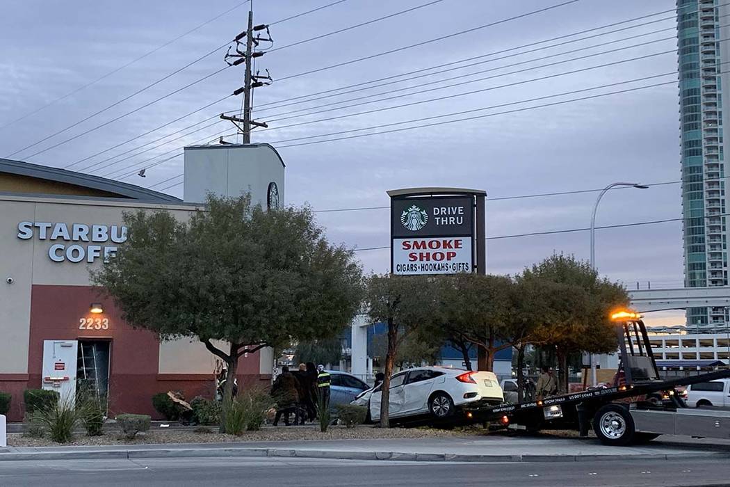 A car crashed into the wall of a Starbucks in its drive-thru lane at Sahara Avenue and Paradise Road, Friday, March 1, 2019. (Jessica Terrones/Las Vegas Review-Journal)