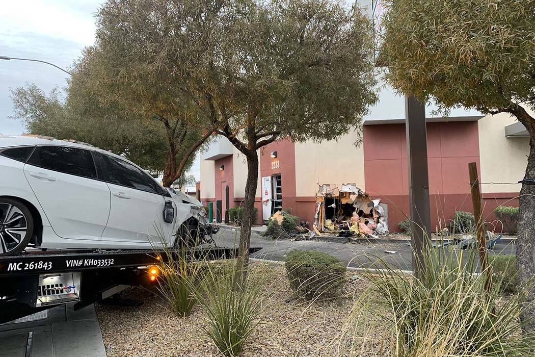 A car crashed into the wall of a Starbucks in its drive-thru lane at Sahara Avenue and Paradise Road, Friday, March 1, 2019. (Jessica Terrones/Las Vegas Review-Journal)