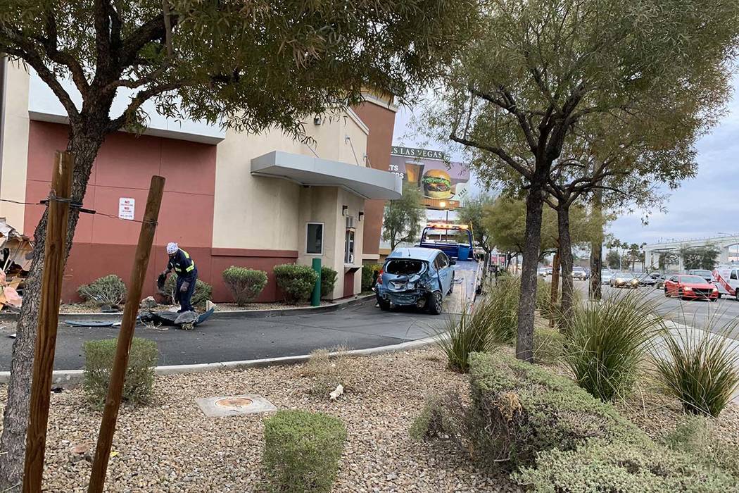 A car crashed into the wall of a Starbucks in its drive-thru lane at Sahara Avenue and Paradise Road, Friday, March 1, 2019. (Jessica Terrones/Las Vegas Review-Journal)