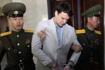 American student Otto Warmbier, center, is escorted at the Supreme Court in Pyongyang, North Korea on March 16, 2016. Warmbier died in June 2017 after he returned to the U.S. in a vegetative state ...